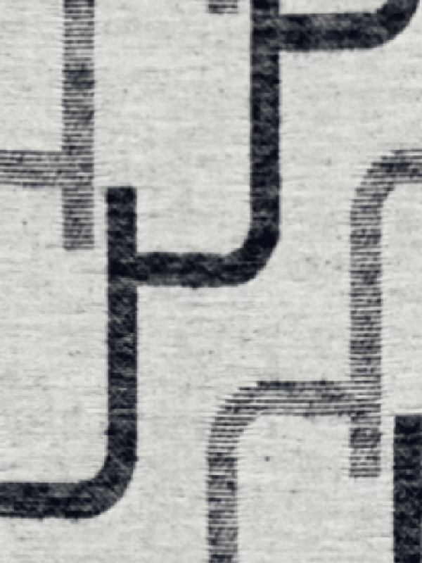 Come viene realizzato il tessuto jacquard in poliestere al 100% e perché il processo è importante?